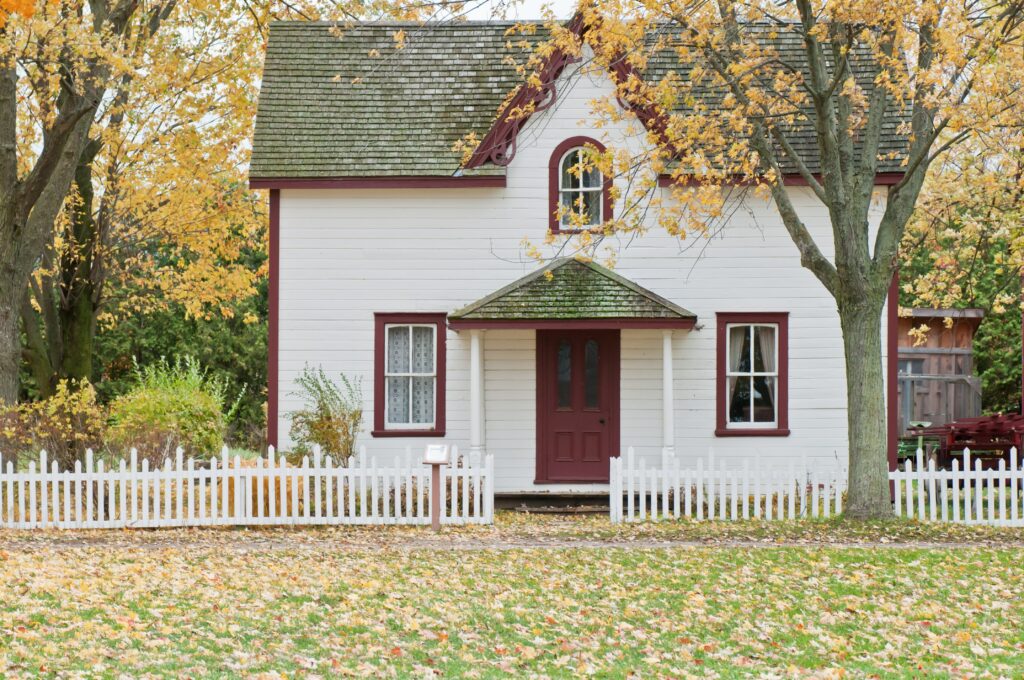 A house surrounded by autumn leaves.